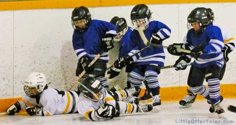 boys hockey game skaters falling
