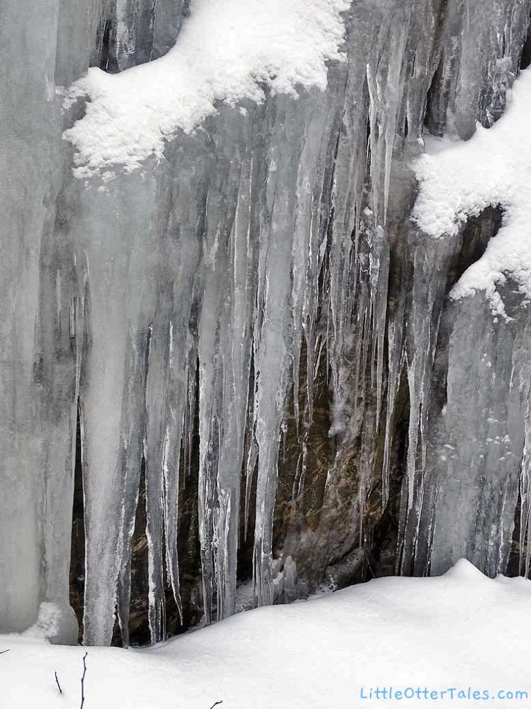 ice waterfall flowing over rock